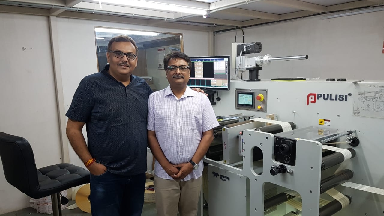 Amit Sheth of Intergraphic with Rajan Vyas of Nitai Press with the new Pulisi machine at the factory in Ahmedabad