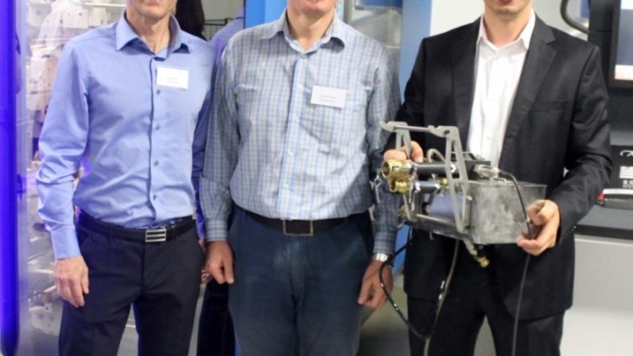 A year ago, Coetzee (center) was the motivating force behind a technical seminar that culminated in a demonstration of a Soma Optima press at Cibapac in Cape Town