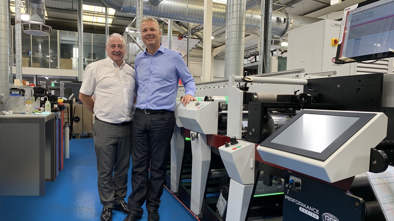 Mark Andy’s UK and Ireland sales manager Paul MacDonald with Berkshire Labels’ managing director Paul Roscoe and the first P9E to be installed in Europe Mark Andy’s UK and Ireland sales manager Paul MacDonald with Berkshire Labels’ managing director Paul Roscoe and the first P9E to be installed in Europe