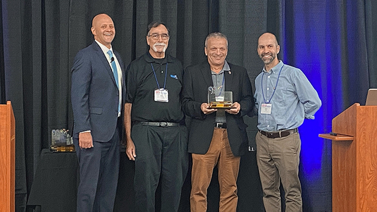 Kurt Oegerli, sales manager of Bobst North America, receiving the Golden Cylinder Award for Technical Innovation at the AIMCAL 2022 R2R Conference Kurt Oegerli, sales manager of Bobst North America, receiving the Golden Cylinder Award for Technical Innovation at the AIMCAL 2022 R2R Conference