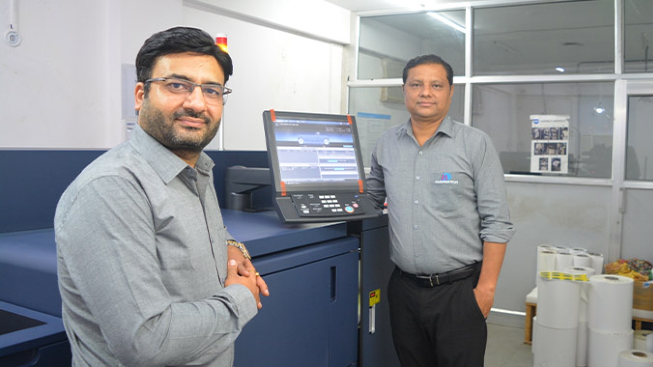 (Left) Dheeraj Sharma, owner of MD Graphics with his new Konica Minolta AccurioLabel 230