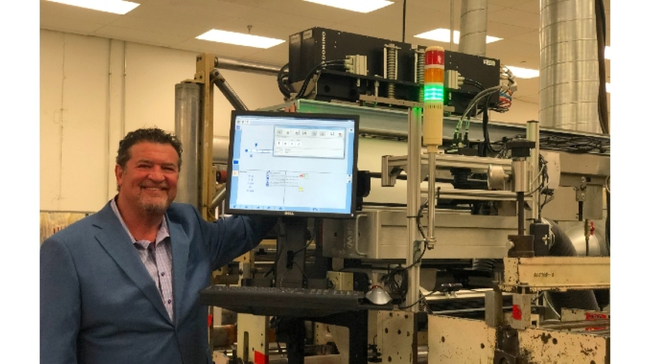 John Abbott with Domino K600i dual bar digital UV inkjet printer John Abbott with Domino K600i dual bar digital UV inkjet printer