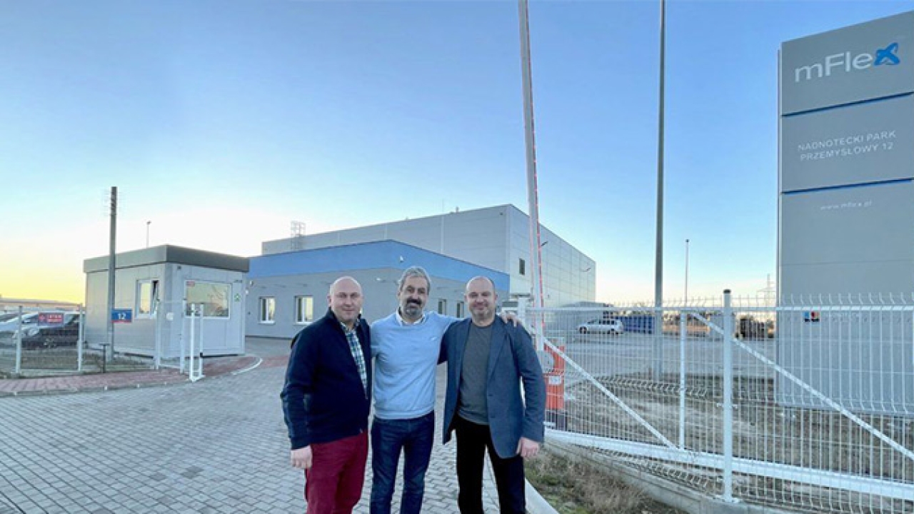 L-R - Marcin Kowalski, Johnny Hobeika, and Jacek Ciosek in front of mFlex headquarters in Poland.