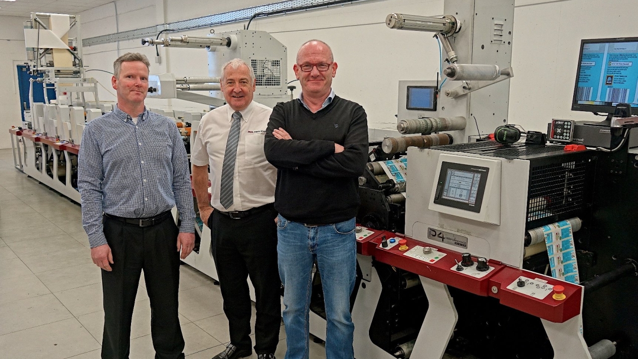 Declan Boran (left), Paul Macdonald (middle) and Ian Bowden with HB Label Print's new P4 - Mark Andy's first press in Ireland with UV LED curing