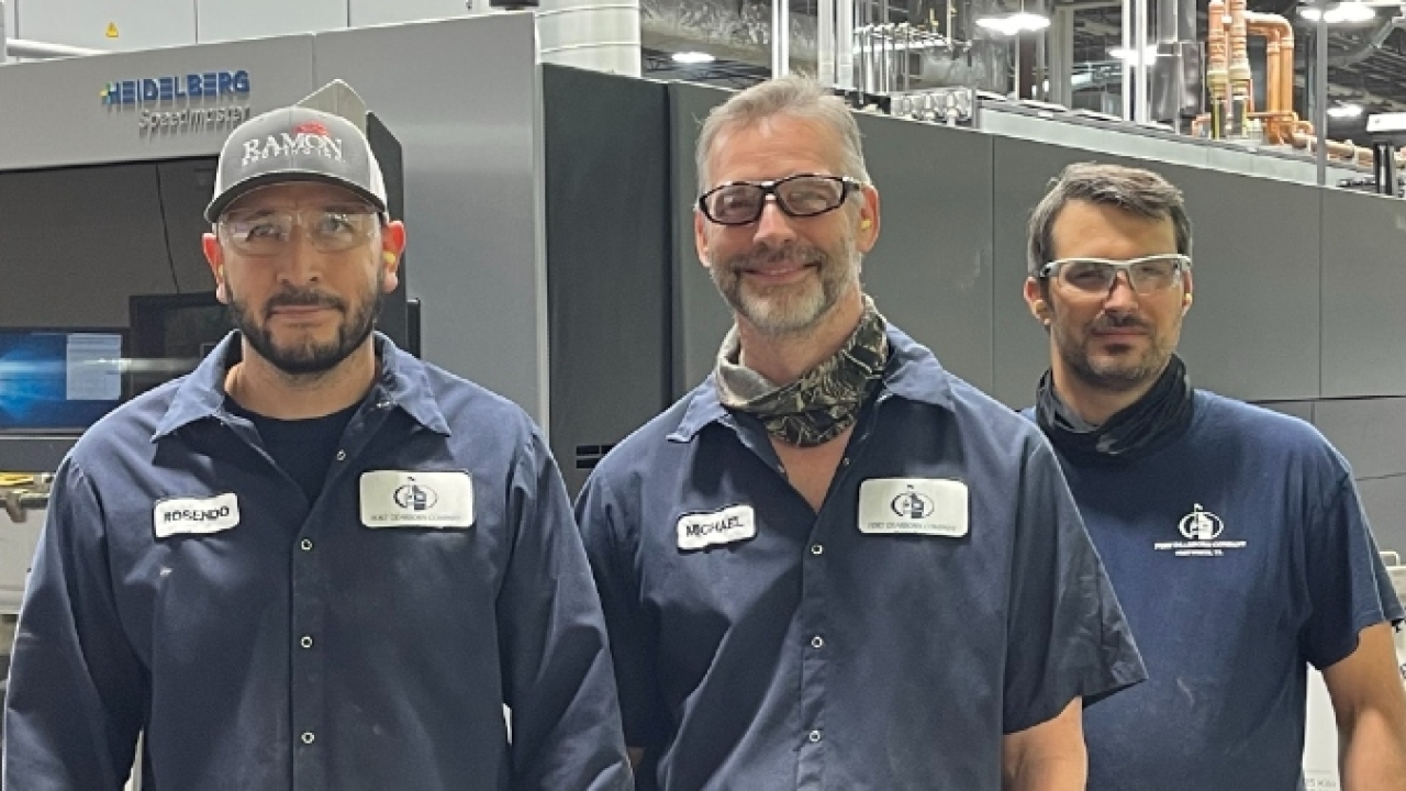 Fort Dearborn Company team members from left to right: Rosendo Pozos and Brent Baldwin, press operators and Mike Suarez, maintenance technician