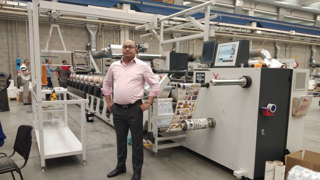 Gautam Nerker of Unique Photo Offset in front of the new Omet X4 press installed at his factory in Mumbai