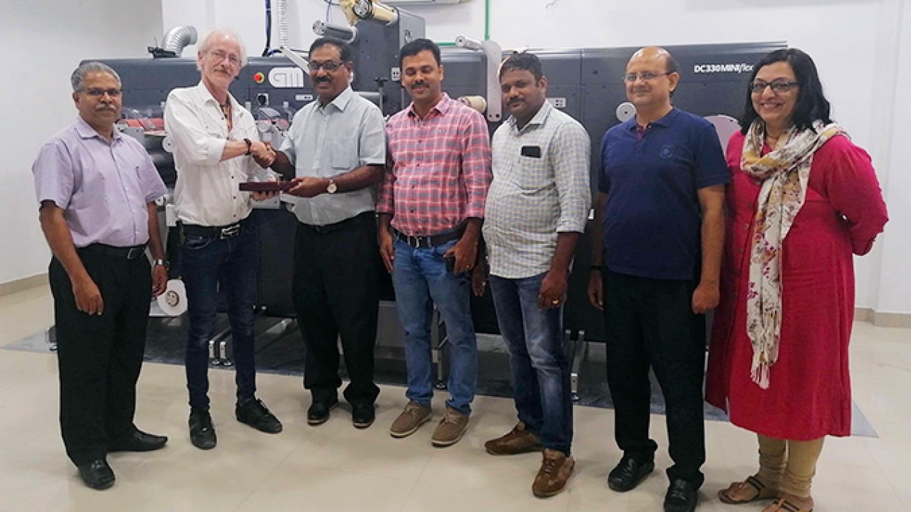 Xpress Labels team and Renil Thomas - Xpress Labels Managing Director shaking hands with Ib Reker Andersen – GM Senior Field Engineer.