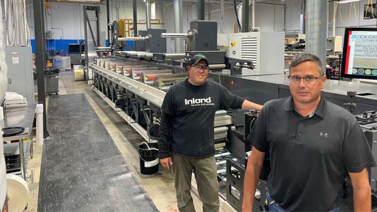 Inland Packaging press operator, Ronnie Goll, and 1st shift press supervisor, Brian Watson, with the recently installed Nilpeter FA-17