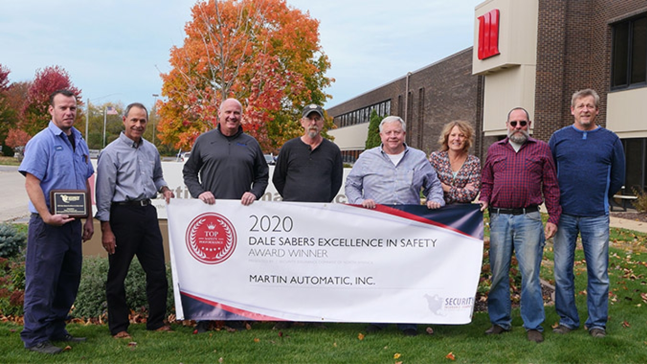 Jon Bauch (third from left) and Martin Automatic’s Safety Committee display the 2020 Dale Sabers Safety Award plaque and banner