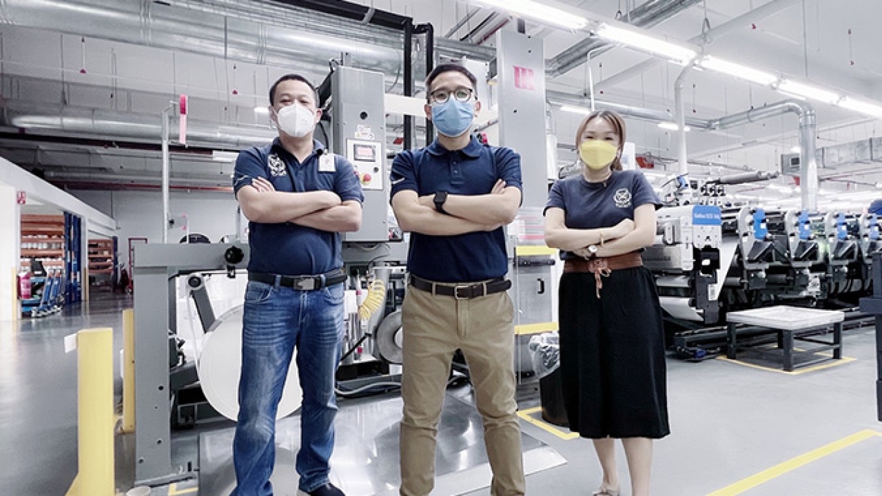 L-R: Nicky Tan, product development manager; Edmund Chan, group general manager; Moon Gan, senior commercial manager of Mega Label with new Martin Automatic MBSC unwind splicer