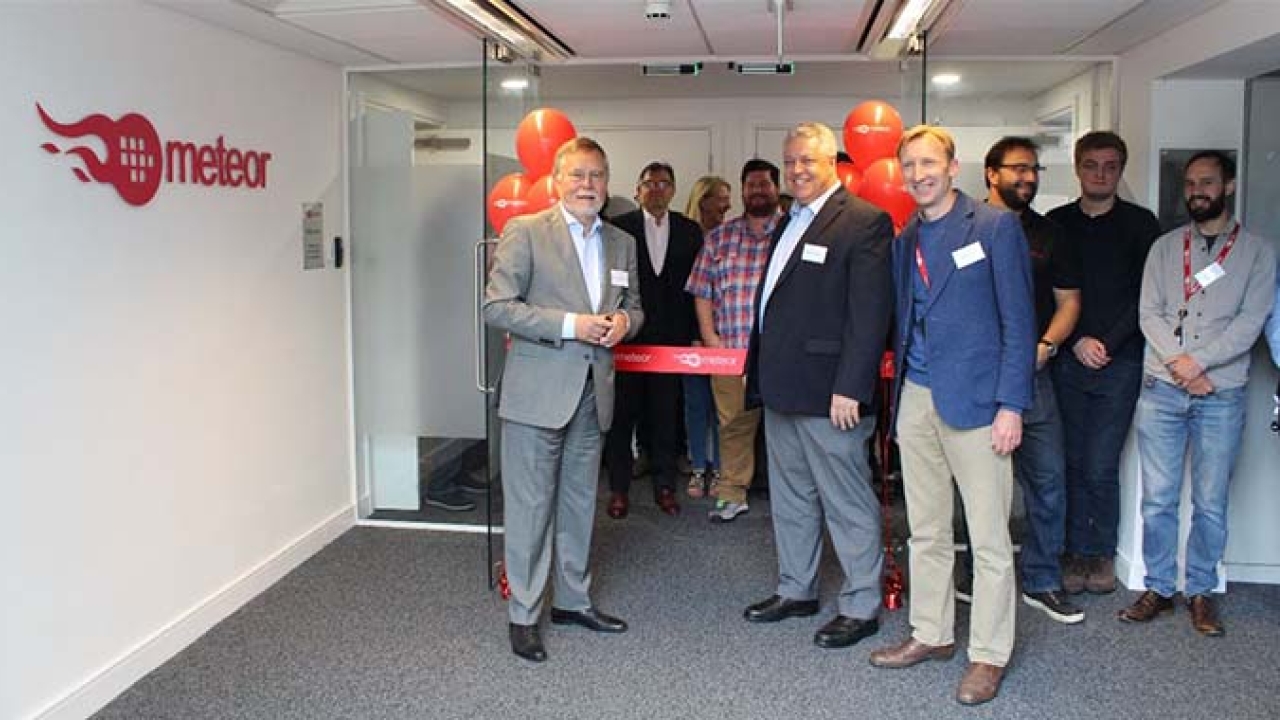 Global Graphics chairman of the board, Guido van der Schueren, accompanied by Mike Rottenborn, CEO, cut the ribbon to open the Meteor Inkjet’s new facility