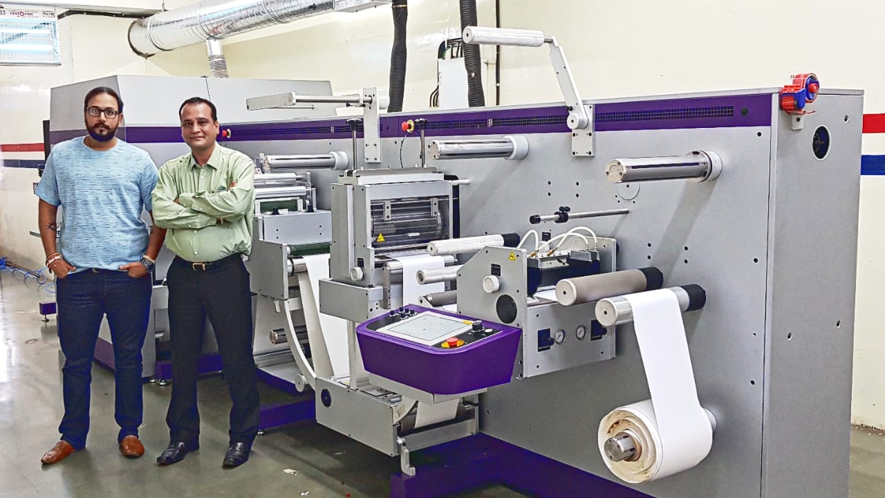 Uday Lodha (L) with Prasanna Sahu in front of the new Colornovo press from Monotech Systems