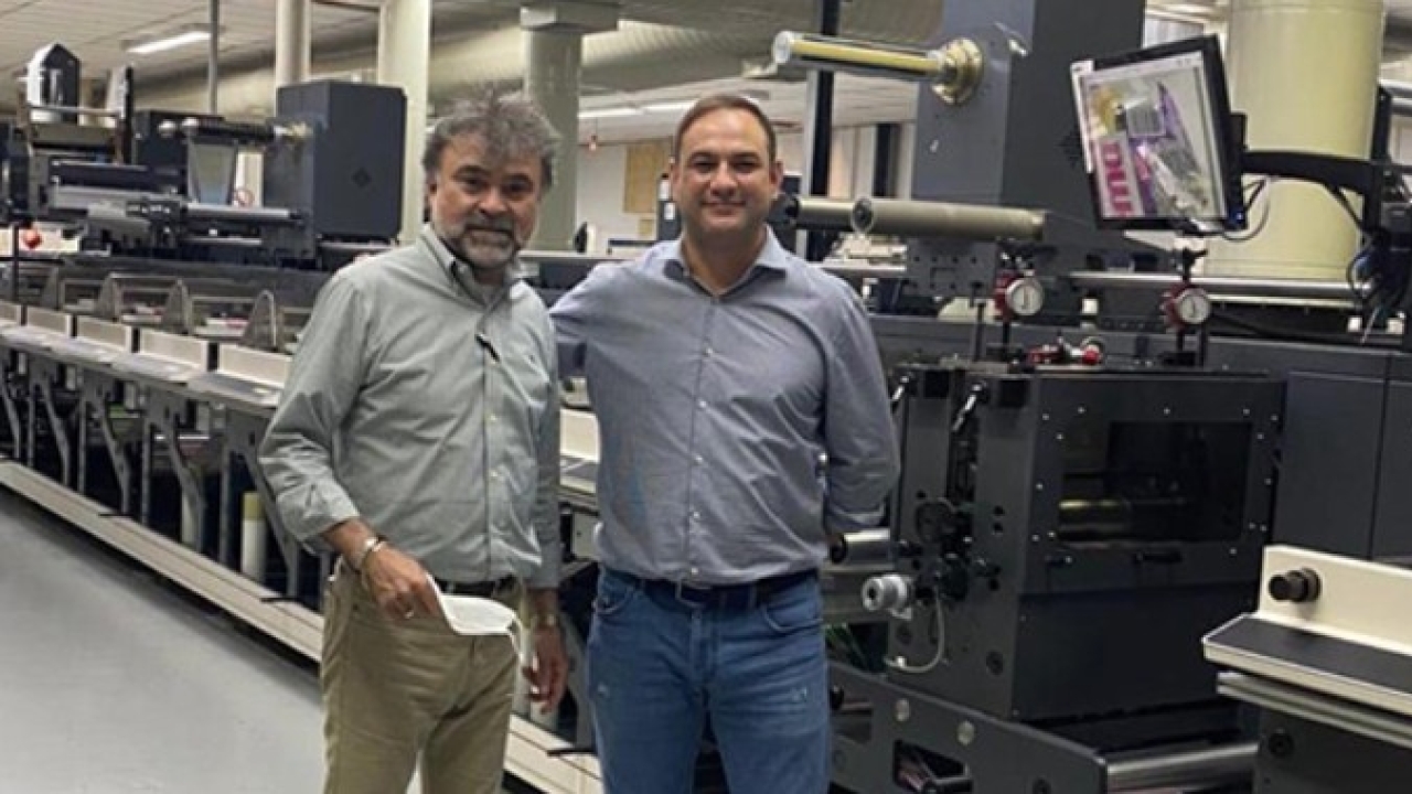 Francisco Paz, owner of Grif, poses with Rubens Wilmers of Nilpeter Brasil, in front of one of the new Nilpeter FA-17 presses