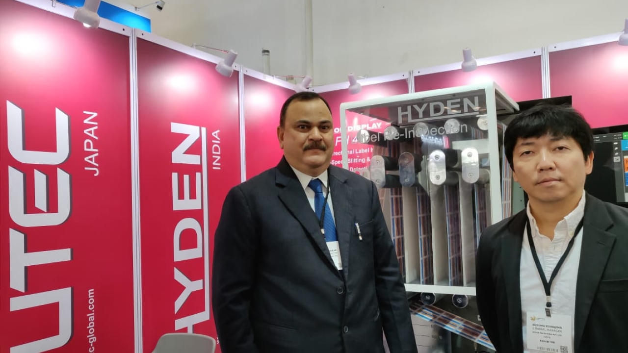 Pramod Jayakar, managing director of Hyden Packaging, with Kuwajima Susumu, general manager of Futec, in front of the newly launched FH400B slitter rewinder at Labelexpo India 2018