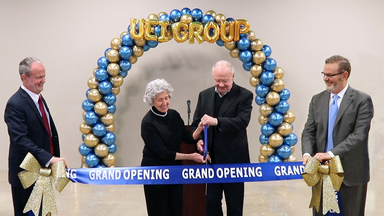 Glenn and Sue Hutchison, the chairman of the board and his wife, cut the ribbon. Also pictured are Larry Hutchison and Jim Hutchison
