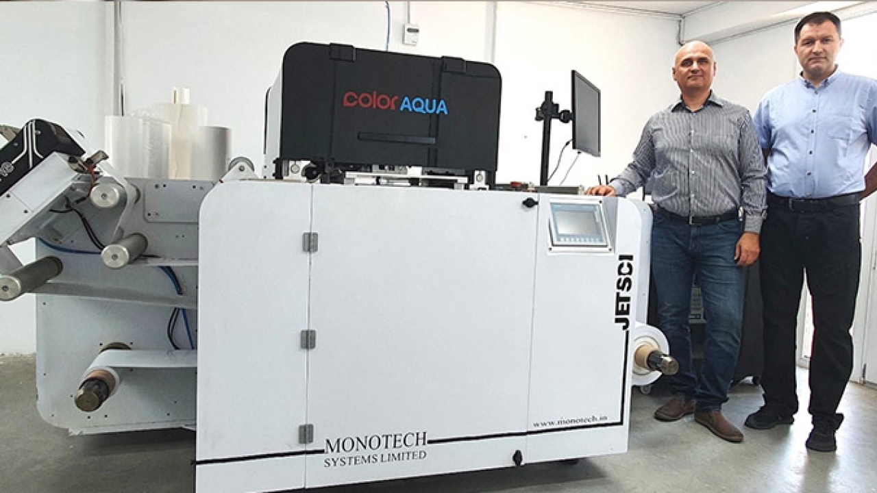 L-R: Mr. Ionut Buhagiar and Dan Preda, partners at PlusPrint in front of the newly installed Jetsci ColorAqua full-color digital press