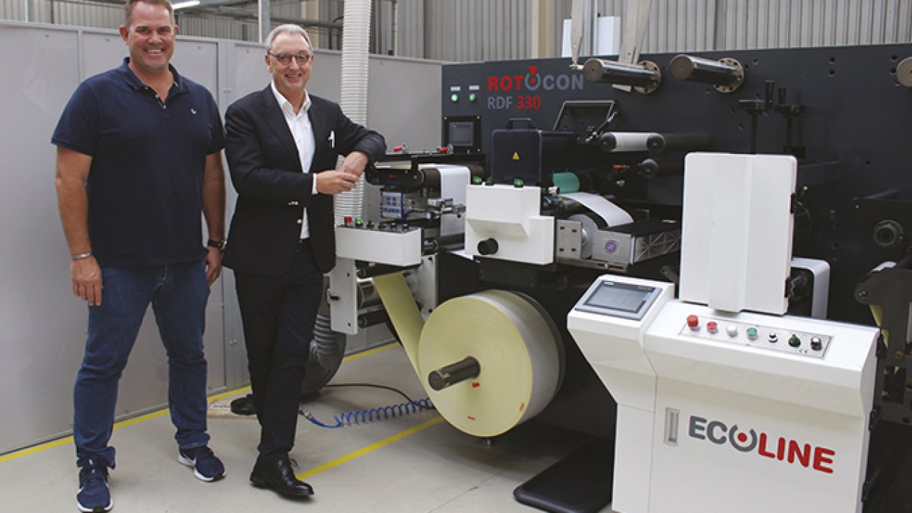 Hilton van Rensburg (VR Print) and Michael Aengenvoort (Rotocon) with the Rotocon Ecoline RDF 330 digital label converting and finishing machine
