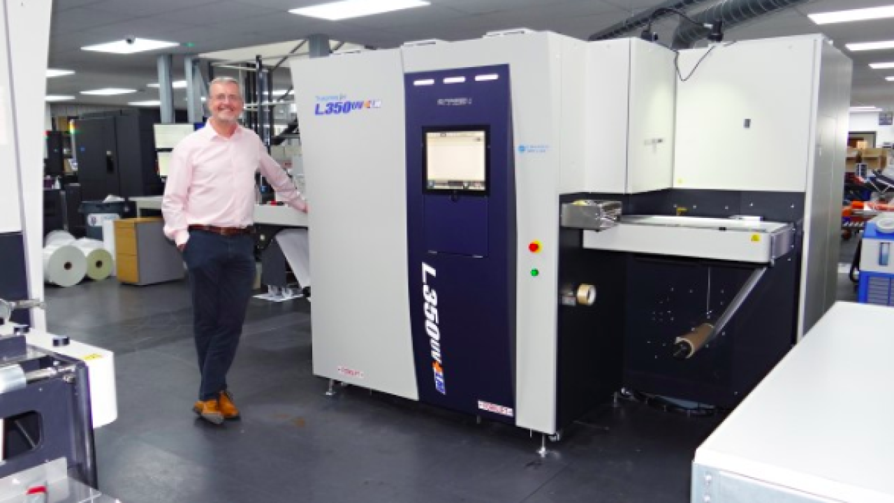 Steve Baker, managing director of Baker Labels with new press Steve Baker, managing director of Baker Labels with new press
