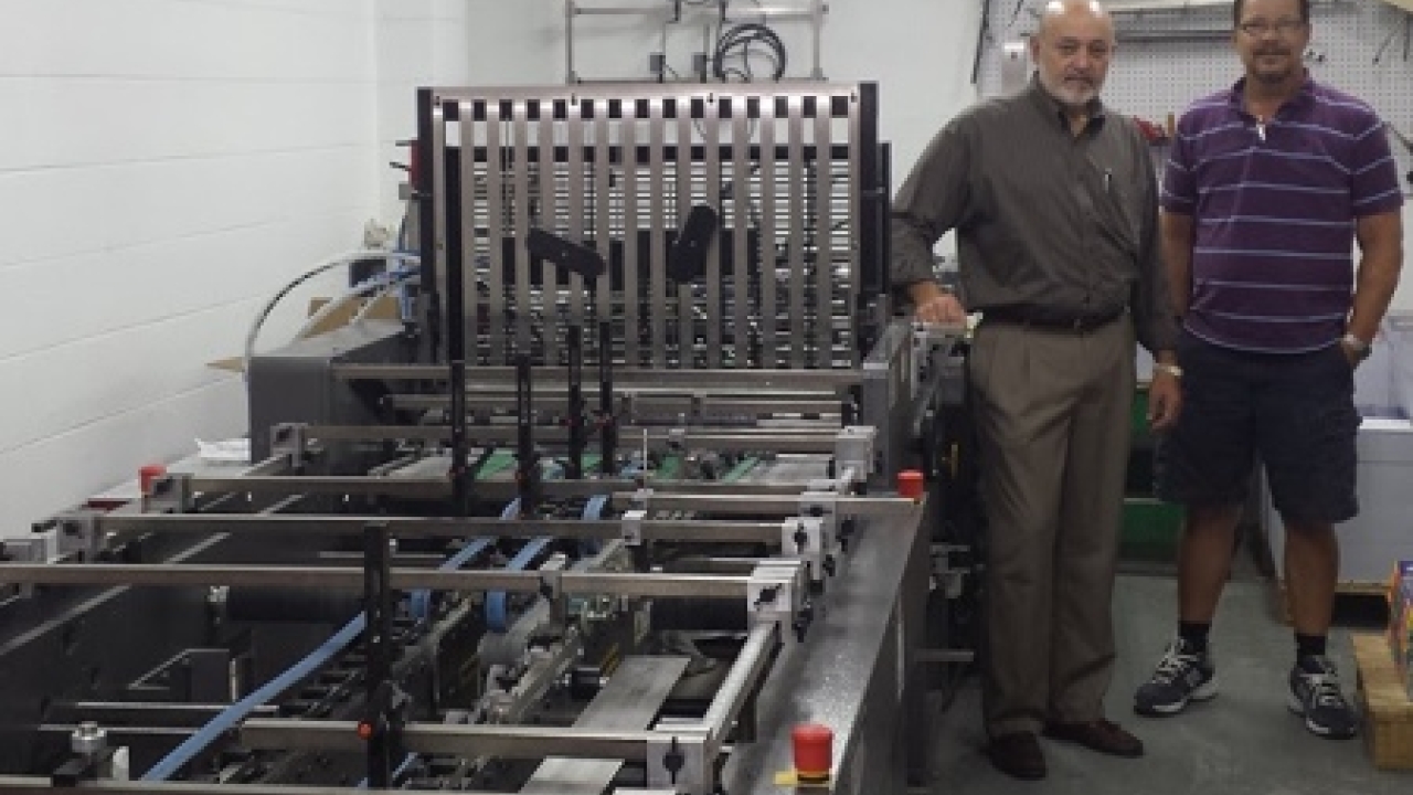 Bill Serata (left), owner, and Todd Pemberton, letterpress and finishing manager, stand next to C&D Printing's new OmniFold folding and gluing system Bill Serata (left), owner, and Todd Pemberton, letterpress and finishing manager, stand next to C&D Printing's new OmniFold folding and gluing system