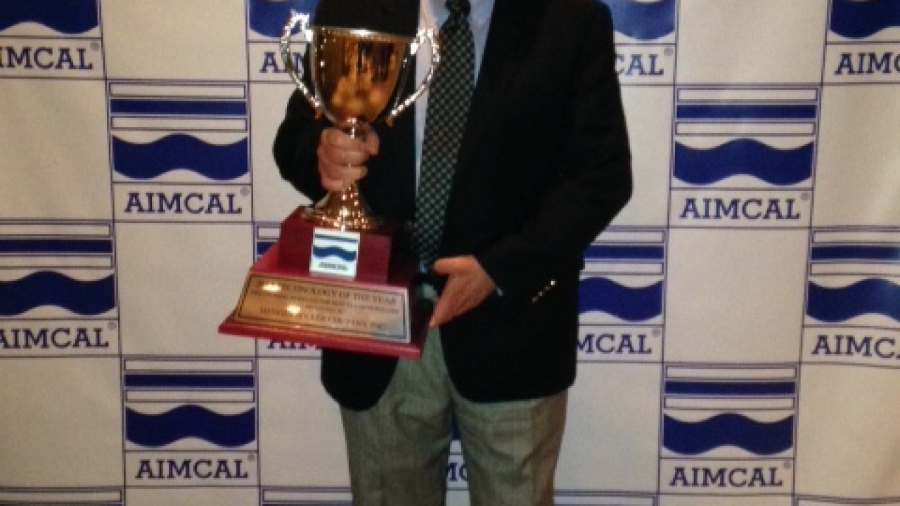 Matt Menges of Menges Roller with the AIMCAL Technology of the Year trophy