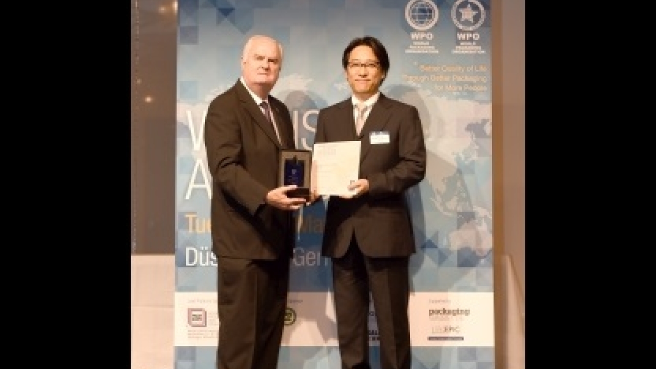 Pictured: Takuya Kato (right), of Heartheart Corporation, receiving the President's Gold Award in the 2014 WorldStar Packaging Awards Pictured: Takuya Kato (right), of Heartheart Corporation, receiving the President's Gold Award in the 2014 WorldStar Packaging Awards