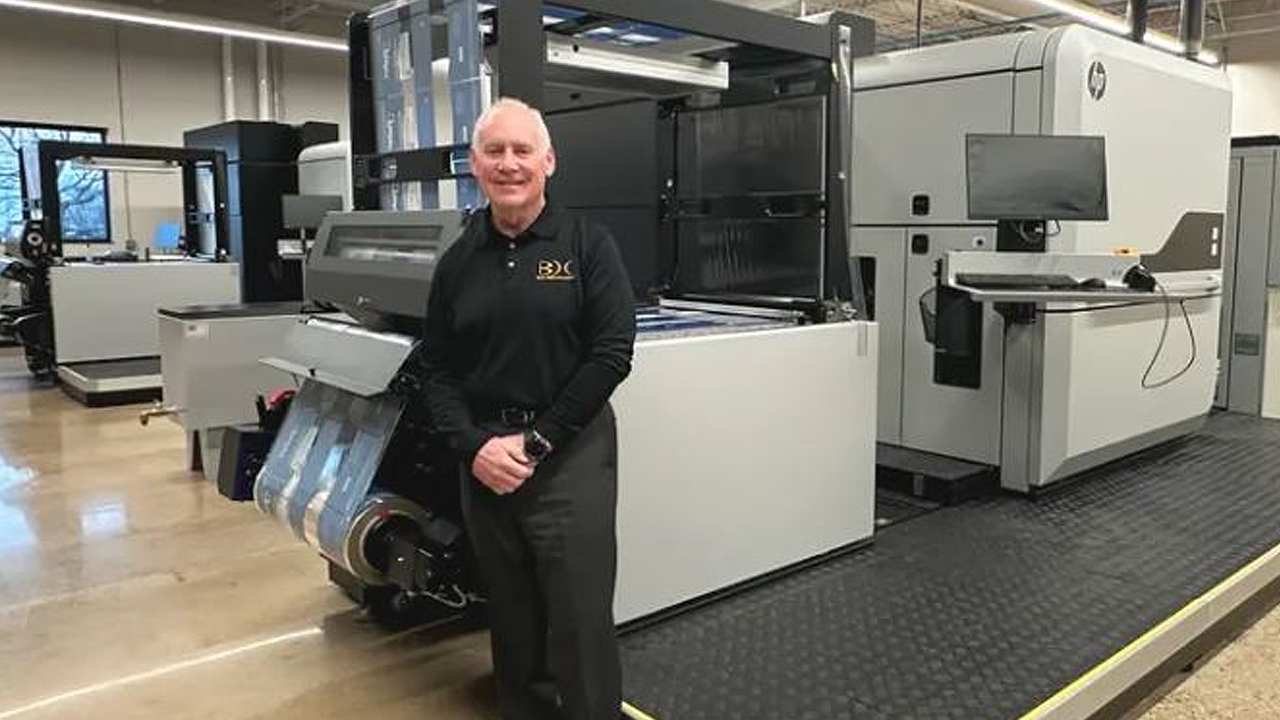Glen Galloway, president of Galloway Consolidated Holdings in front of the HP Indigo 25K press at Bema. 