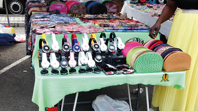 Figure 2.1 - Counterfeit headphones and purses openly on sale at a street market in Spain (2014)
