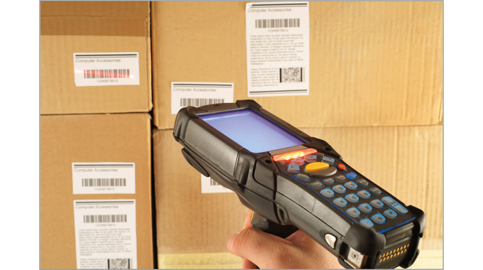 Fig. 5.8 A hand-held scanner being used to read barcodes in a warehouse