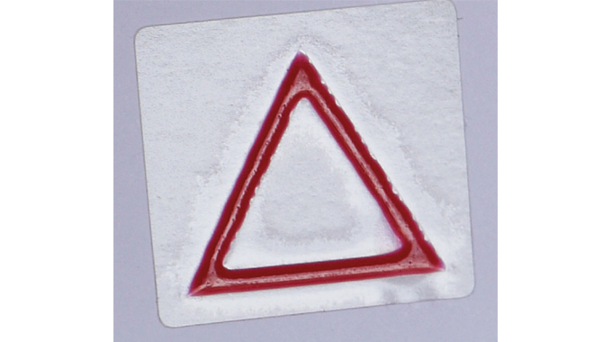 Figure 10.5 - Tactile Warning Triangle on labels with hazardous contents – used for the blind or visually impaired