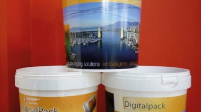 Figure 2.9 Digital heat transfer onto plastic containers. Digital decorating system jointly developed by Xeikon and Italy-based Moss