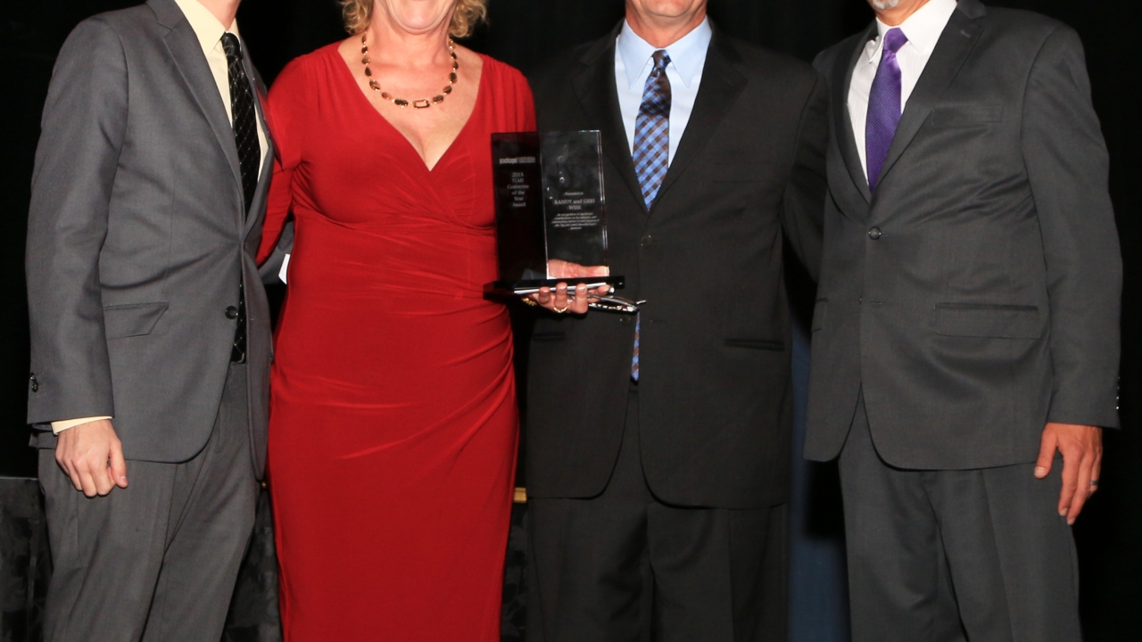 Geri and Randy Wise in the center of the photo aceepting TLMI Converter of the Year Award.jpg