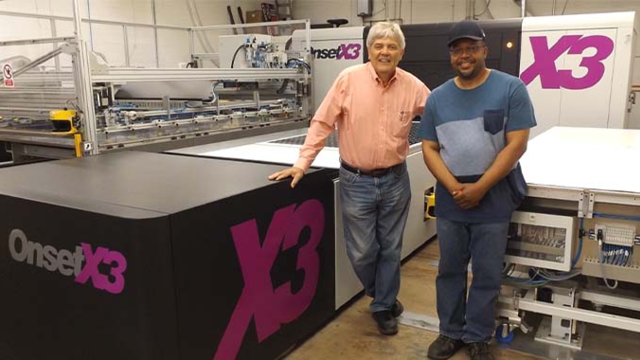 CEO Mark Turk (left) and press operator Alvin Page in front of the Inca OnsetX3 CEO Mark Turk (left) and press operator Alvin Page in front of the Inca OnsetX3