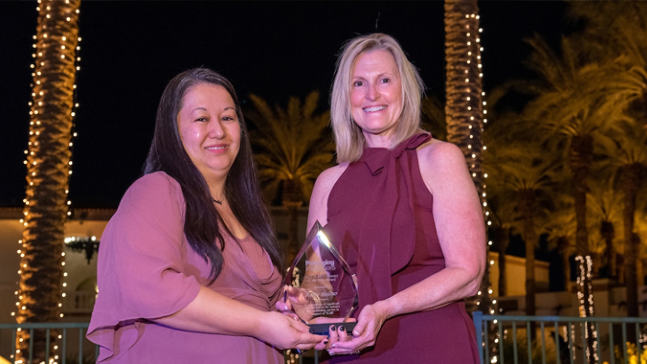 Linda Casey,  editor-in-chief of Packaging Impressions presents Kathy Alaimo with the 2022 Converter of the Year award