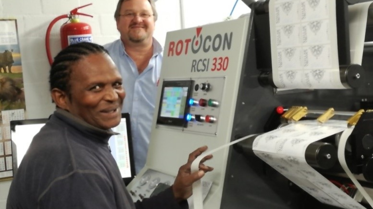 Win-Pak print manager Basil Forbes (left) with the company's new Rotocon Ecoline RCSI 330 slitter rewinder